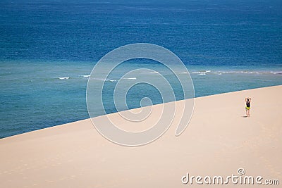 Girl walking on the white dunes on the Bazaruto Island Stock Photo