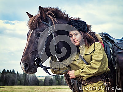 Girl warrior Cossack with a horse. Portrait. Stock Photo