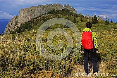 Girl watching a huge mountain crest in the distance Stock Photo