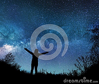 Girl watching the stars in night sky Stock Photo