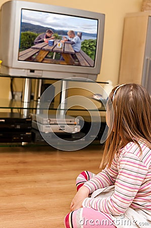 Girl watching TV Stock Photo