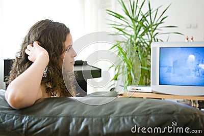 Girl watching tv Stock Photo