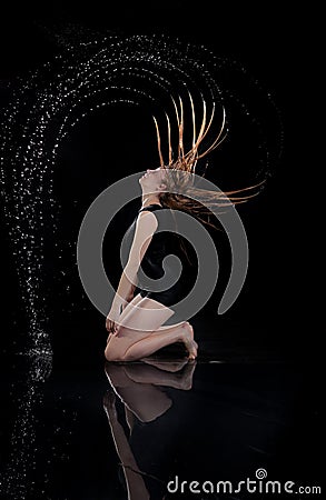 Girl water circle hair black background Stock Photo