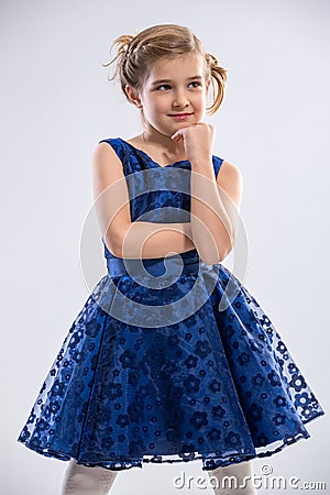 Girl wearing blue dress Stock Photo