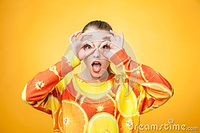 Girl wearing orange printed sweatshirt Stock Photo
