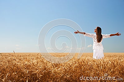 Girl on wheat field Stock Photo