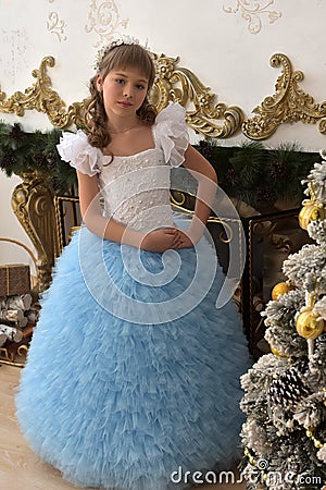 Girl in white with blue festive dress Stock Photo