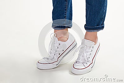 Girl in white gumshoes. Stock Photo