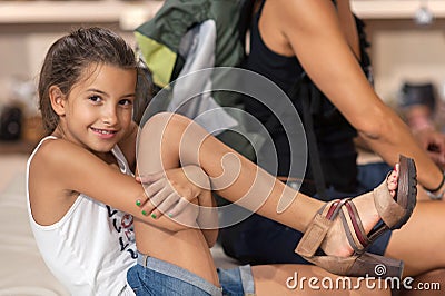 Girl who tries women's shoes Stock Photo