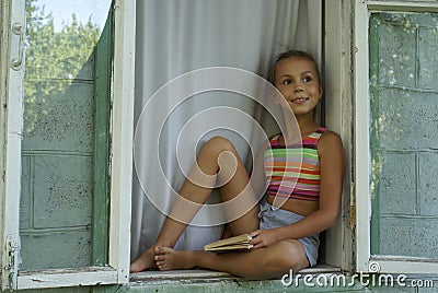 Girl in window Stock Photo