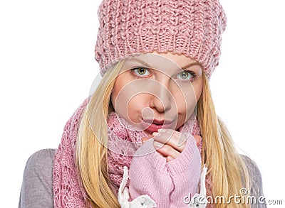 Girl in winter clothes warming hands Stock Photo