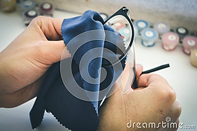 Girl wipes glasses with napkin Stock Photo