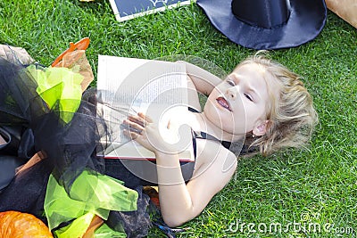 Girl in a witch costume for the Halloween holiday. Stock Photo