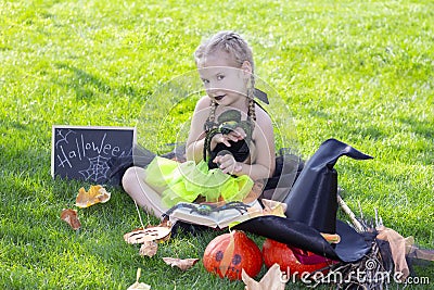 Girl in a witch costume for the Halloween holiday. Stock Photo