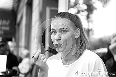 Girl or woman eat with fork in cafe in paris Stock Photo