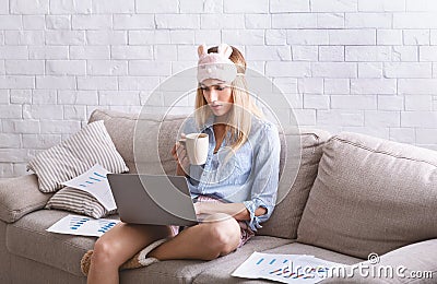 Girl work at home with laptop and charts Stock Photo