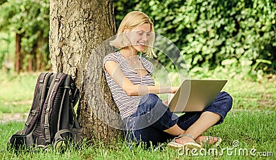 Girl work with laptop in park. Reasons why you should take your work outside. Lunch time relax or coffee break. Nature Stock Photo