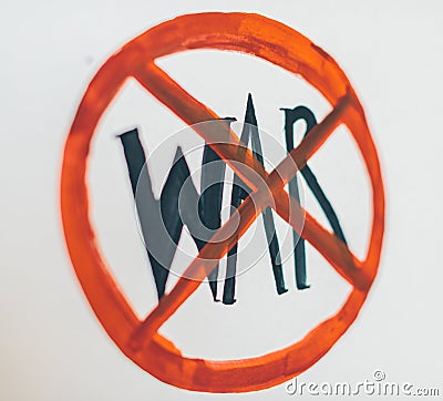 The girl writes the word war in the red circle Stock Photo