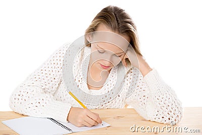 Girl writing in copybook Stock Photo