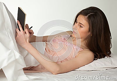 Girl writing in dreambook Stock Photo