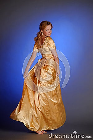Girl in yellow evening long dress Stock Photo