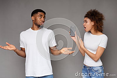 Girlfriend asking for explanation to her cheater boyfriend Stock Photo