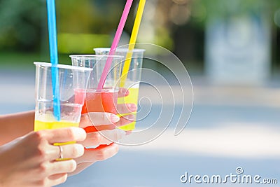 Girlfriends enjoying cocktails in an outdoor cafe, hands detail shot Stock Photo