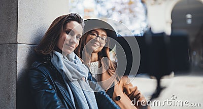 Girlfriends tourist taking photo selfie portrait together on smartphone mobile. Blogger hipster travels in europe city. Vacation Stock Photo