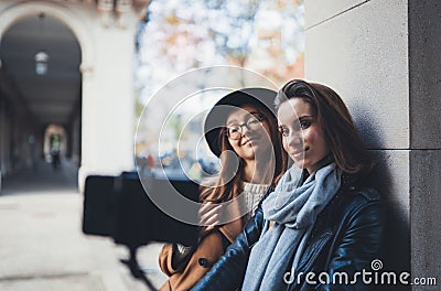 Girlfriends tourist taking photo selfie on smartphone mobile. Blogger hipster travels in europe city. Vacation holiday friendship Stock Photo
