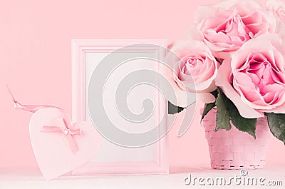 Girlish gentle Valentine days mockup - blank frame for text, exquisite pink roses, heart with ribbon, gift box on white wood. Stock Photo