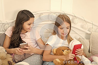 Girlish leisure happy childhood. Girls with smartphone use modern technology. Lets take selfie. Send selfie photo your Stock Photo