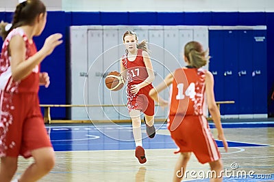 Girls athlete in sport uniform playing basketball Stock Photo