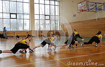 Girls basketball players warm up before participating in city competitions Editorial Stock Photo