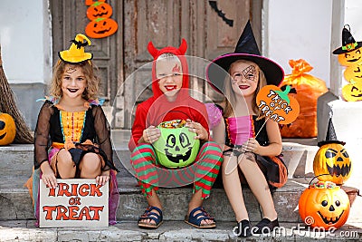 Girls and boy in halloween costumes Stock Photo