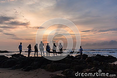 Girls Boys Family Silhouetted Beach Ocean Sunrise Stock Photo