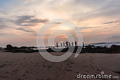 Girls Boys Family Silhouetted Beach Ocean Sunrise Stock Photo