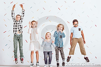 Girls and boys jumping Stock Photo