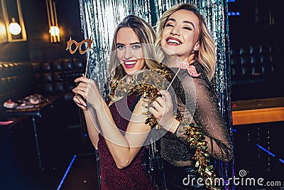 Girls celebrating new years eve at the nightclub. Stock Photo