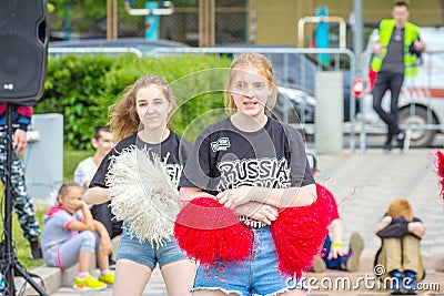 Girls from the cheerleading group at the high school graduation celebration Editorial Stock Photo