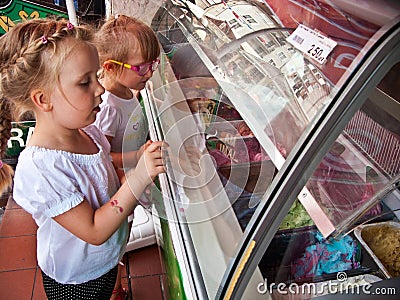 Girls choosing ice cream flavour Stock Photo