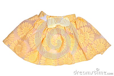 Girls clothes. Festive beautiful yellow little girl short summer skirt with floral pattern and a golden ribbon bow isolated on a Stock Photo