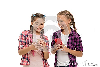 Girls cute small children smiling to phone screen. They like internet surfing social networks. Problem of young Stock Photo