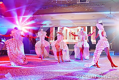 Girls dancers in beautiful stage costumes dancing at a festive banquet. Editorial Stock Photo