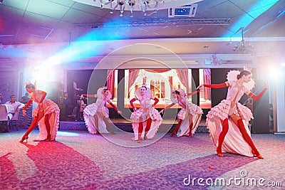 Girls dancers in beautiful stage costumes dancing at a festive banquet. Editorial Stock Photo