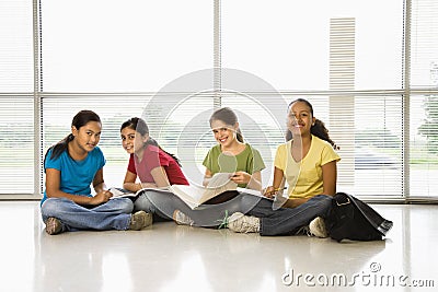 Girls doing schoolwork. Stock Photo