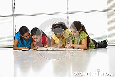 Girls doing schoolwork. Stock Photo