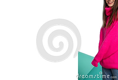 Girls without a face in jeans and a pink sweater on a blue background. Mock up for your text or advertisings Stock Photo