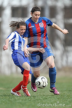 Girls fighting for ball during soccer game Editorial Stock Photo