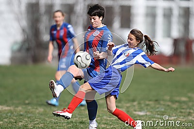 Girls fighting for ball during soccer game Editorial Stock Photo