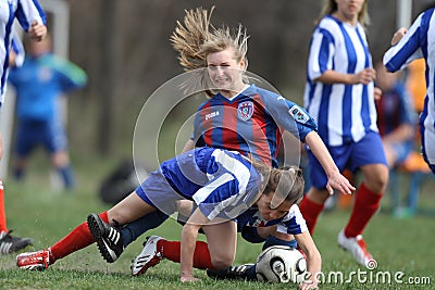 Girls fighting for ball during soccer game Editorial Stock Photo